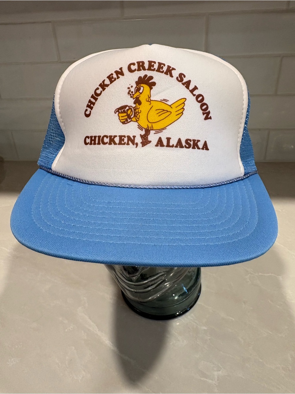 Chicken Creek Saloon Trucker Hat - Blue & White Chicken Alaska